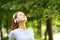 Woman wearing headphones meditating listening audio guide