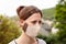 Woman is wearing a homemade fabric cloth face mask, coronavirus and covid-19 prevention and protection