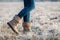 Woman wearing leather boots with fur at winter