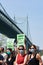 Woman Wearing Masks with Green New Deal Signs at an Earth Day Celebration hosted by Alexandria Ocasio-Cortez in Astoria Queens