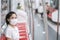 Woman wearing Medical face mask and listening music by earphones in train. public transportation and safety under covid-19