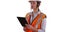 Woman wearing orange vest and hardhat working on tablet on white background