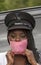 Woman wearing a pink collared face mask