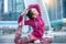 Woman wearing pink sportswear in One Legged King Pigeon pose