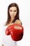 Woman wearing red boxing gloves