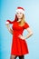 Woman wearing Santa Claus helper costume