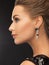 Woman wearing shiny diamond earrings