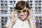 Woman Wearing Stylish Sunglasses in shop