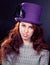 Woman wearing violet hat in retro or fairy stlyle