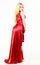 Woman wears elegant evening red dress, white background. Luxury outfit concept. Lady wears fashionable dress for