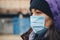 Woman wears protective mask outdoor. Mask against infectious diseases and flu. Health care concept. Stop the infection.