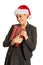 Woman weating Santa hat and holding a present
