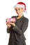 Woman weating Santa hat and holding a present