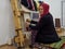 A woman weaving the traditional Turkish carpet