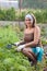 Woman weeding vegetable garden