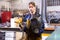 Woman welder in metalworking workshop