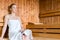 Woman in wellness spa enjoying sauna