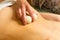 woman in wellness spa having aroma therapy massage with essential oil,Woman enjoying a Ayurveda oil massage treatment in