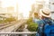 Woman westerner taking photo of sky train track in city in the m