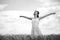 Woman in wheat field, black and white