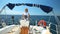 Woman at wheel steering sailboat on Adriatic sea in Croatia