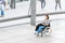 woman with a wheelchair is alone traveling through the exhibition hall at the Bundestag dome