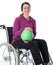 Woman in wheelchair with ball