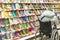 a woman in a wheelchair chooses a book for a child in the children`s department of the store.