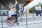 Woman in a wheelchair on a ramp in front of the office