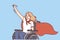 Woman with wheelchair in superhero cape symbolizes determination to overcome difficulties