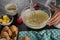 Woman whisking batter of beaten eggs and milk in a bowl