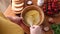 Woman whisking eggs in a wooden bowl