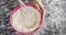 Woman whisking flour in bowl 4k