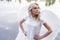 woman with white angel wings. beautiful blonde in angel costume. heaven, purity. good person