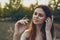 woman in white dress with a praying mantis in hand animals