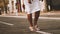 Woman in white dress walking cinematic slow motion