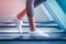 Woman with white shoes fast walking on treadmill with motion blur effects