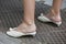 Woman with white shoes with pearls decoration before Emporio Armani fashion show, Milan Fashion Week