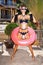 Woman in white sunglasses with pink inner tube