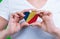 Woman in white t-shirt holds a heart in the form flag Seychelles on her chest.