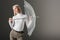 woman in white turtleneck posing with autumn transparent umbrella