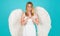 Woman with white wings. Valentines angel praying. Valentine Cupid. February 14.