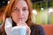 A woman who has recovered from the coronavirus epidemic drinks from a straw in a glass