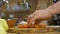 Woman wife in kitchen cutting fresh carrot preparing a vegetable dish