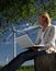 Woman with Wind Turbine and Laptop