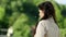 Woman in windy weather being happy to see someone