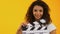 Woman winking and using clapper board, shooting positive film, movie production