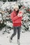 Woman in winter park with gift box. .Beautiful girl in winter snowy forest.  Christmas, holidays and leisure concept - happy young