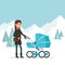 Woman in the winter for a walk with the baby in the pram. Girl with bag on his shoulder against the backdrop of a winter