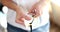 Woman wipes glasses with white napkin closeup